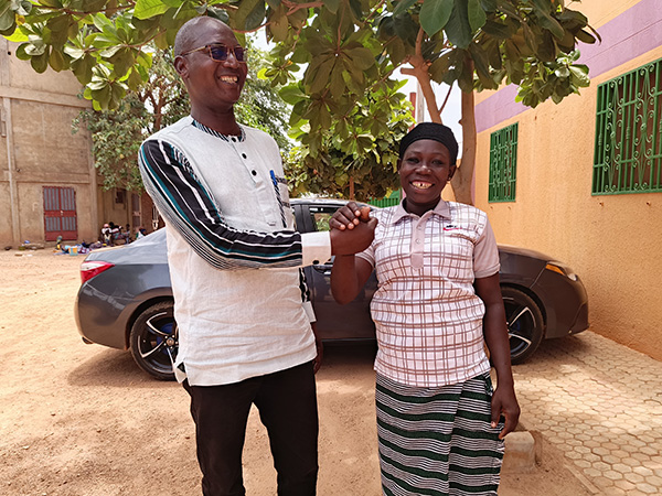 Dr. Itengre welcomes a survivor who returned to visit the ARENA Medical Center.